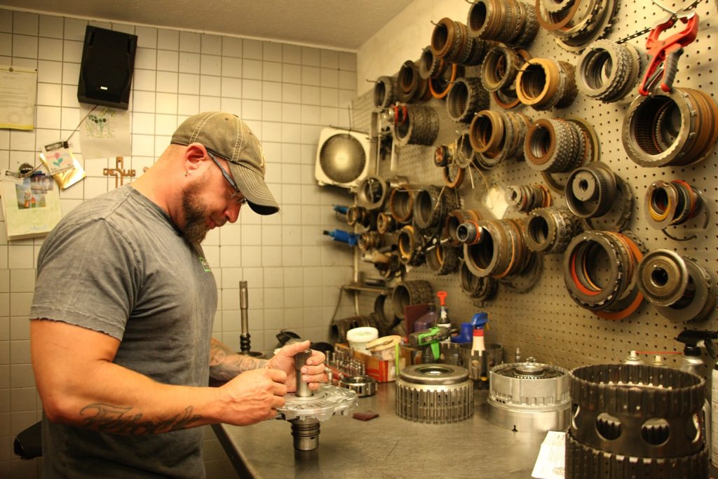 Tranny specialist working on clutch repair at Mastertech Transmission inc auto repair shop in Wichita